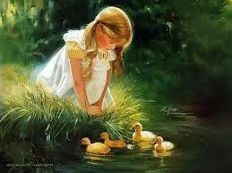 a pretty little blond girl sitting and looking into a pond where 4 fluffy yellow ducklings swim