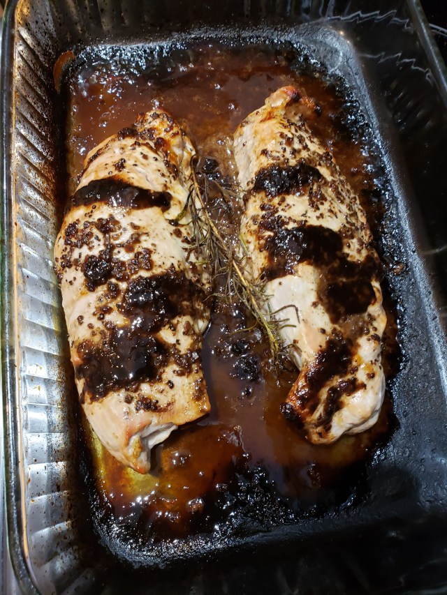 2 browned pork tenderloins in a burned pyrex cake pan